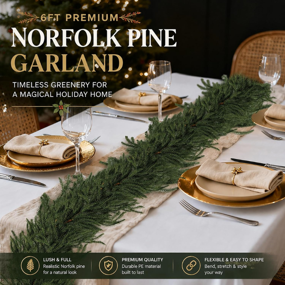 Green 6-foot Norfolk pine Christmas garland arranged on a white surface