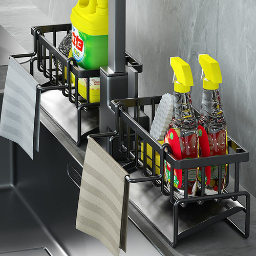 Kitchen sink caddy basket holding a sponge and folded dishcloth