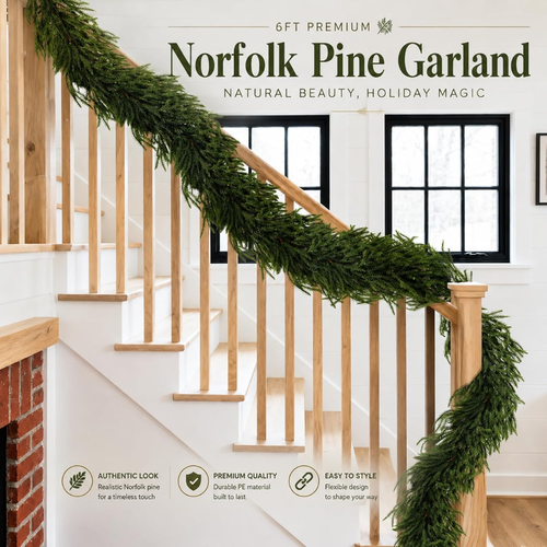 Green 6-foot Norfolk pine Christmas garland arranged on a white surface